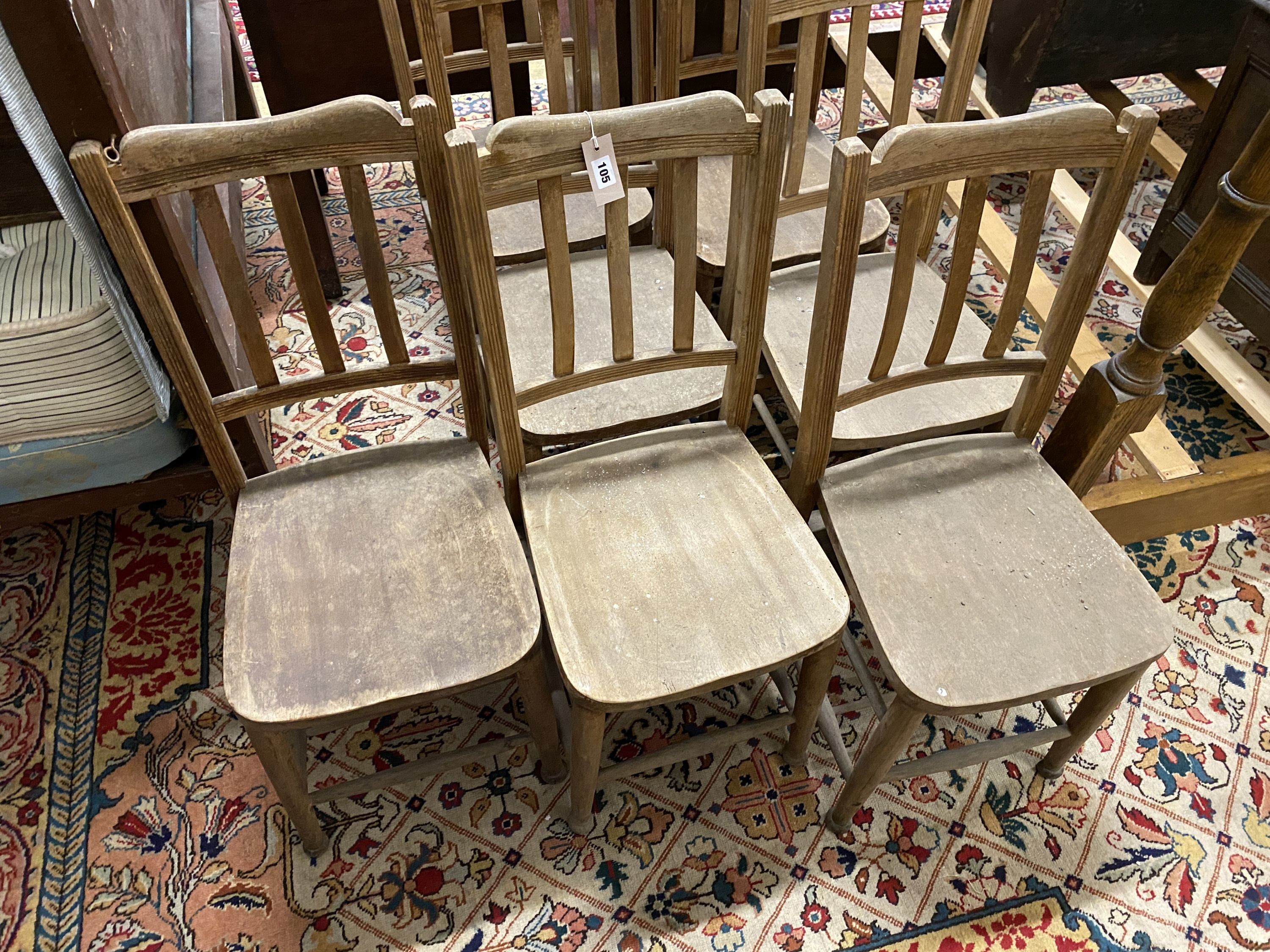A set of seven beech chapel chairs